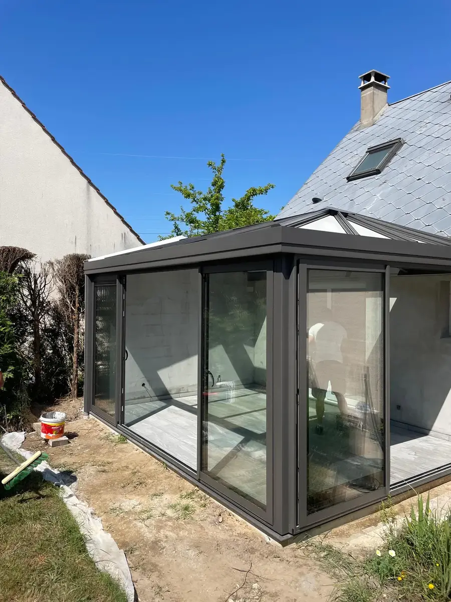 Véranda en aluminium et réfection de terrasse